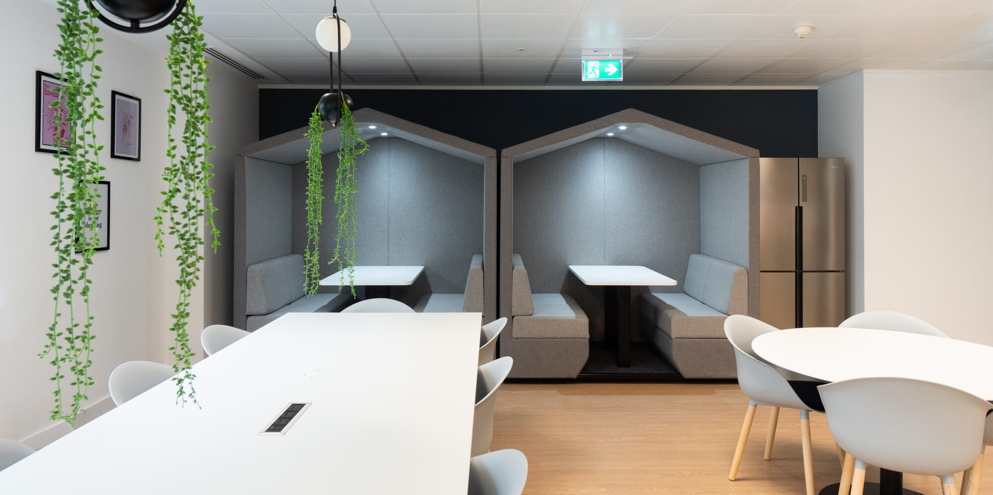 Office pods within an office breakout area.